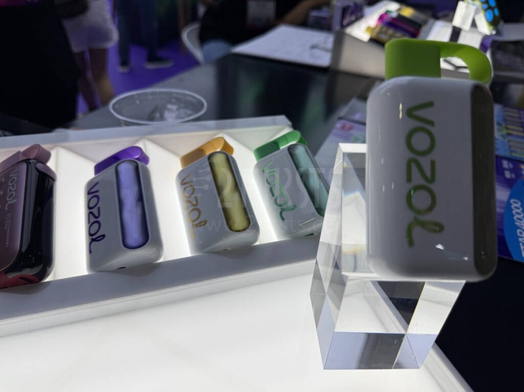 four different flavors of the vozol star 40000 vape displayed on a product stand