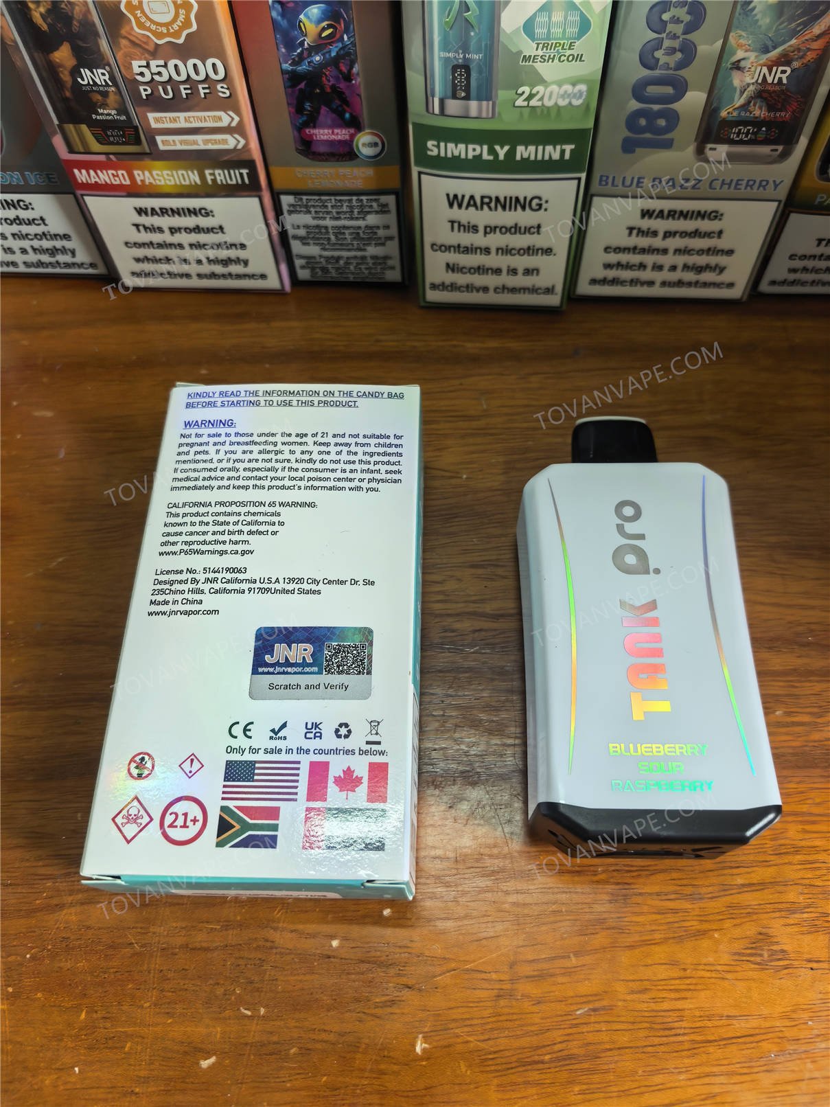 back view of the blueberry sour raspberry jnr tank pro 33k device and its retail box