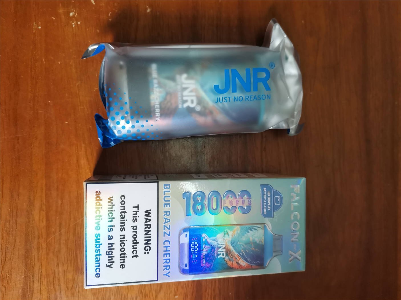 front view of both the jnr falcon x 18k packaging box and its matching storage bag