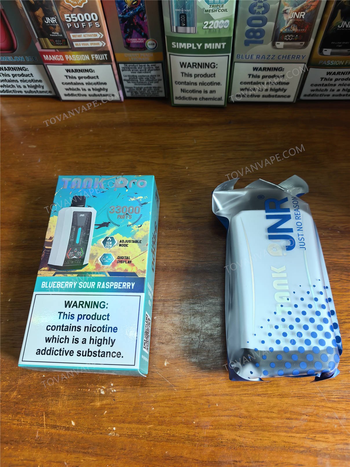 front view of the jnr tank pro 33000 box alongside its sealed inner pouch