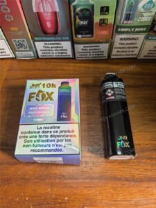 jnr fox 10k mixed berries flavor device shown next to its packaging box