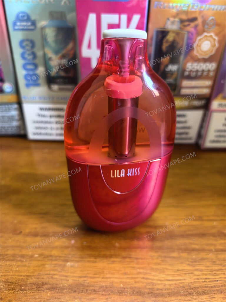 jnr lila kiss 60k standing upright on a table with silicone mouthpiece plug