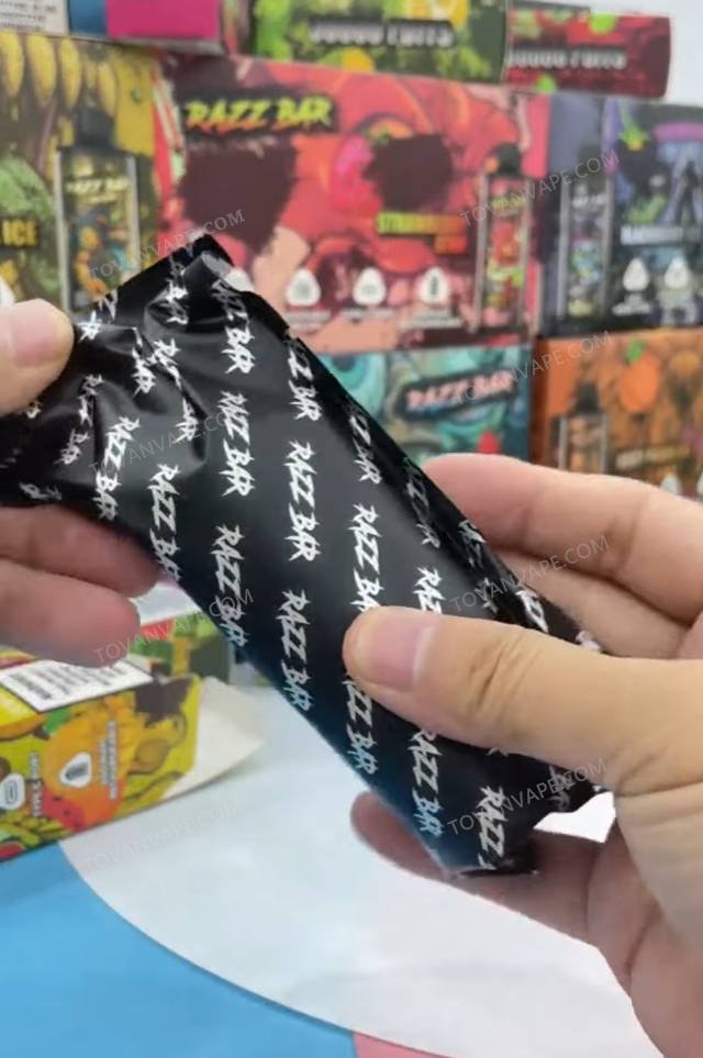 a close look at the sealed inner packaging bag of the razz bar 30k held in hand