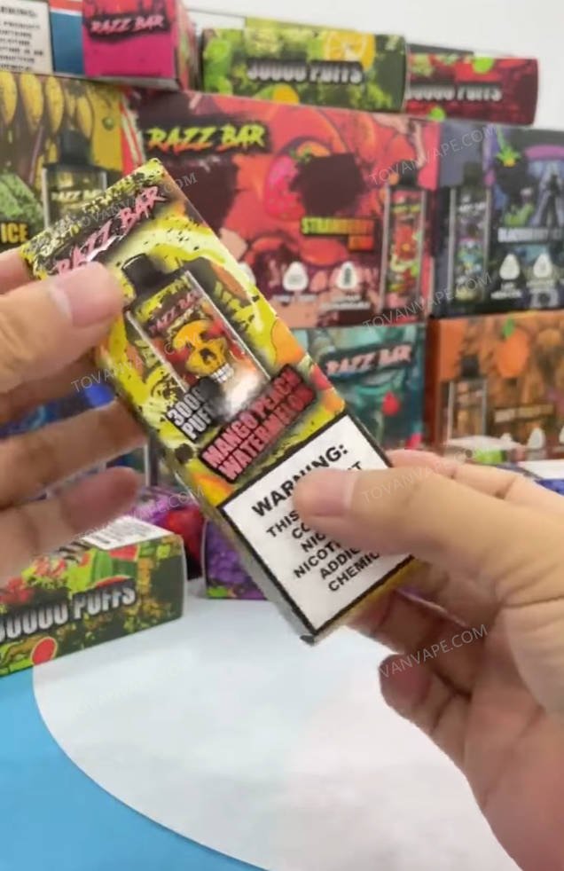 displaying the back of the razz bar 30000 box in hand, showing product details