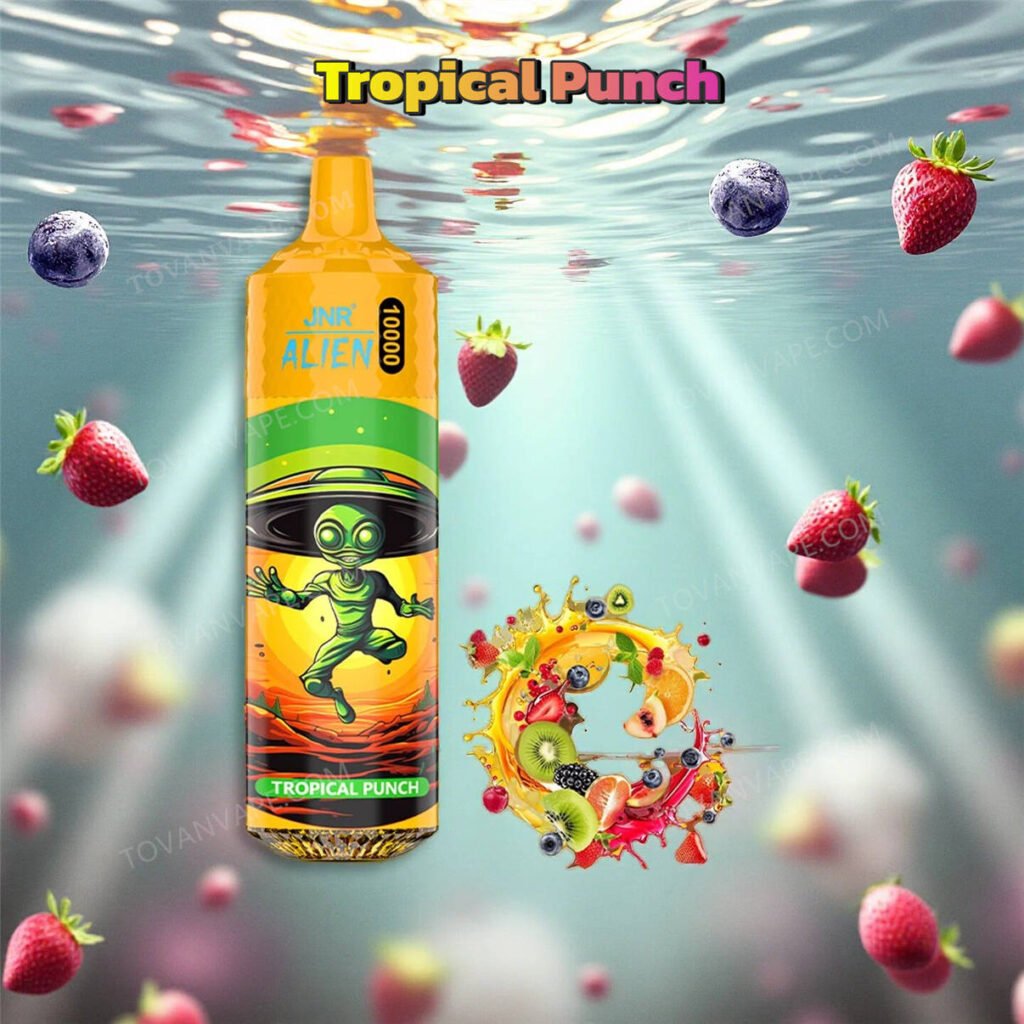 jnr alien 10k vape in tropical punch flavor, surrounded by a fresh mix of tropical fruits like pineapple and orange