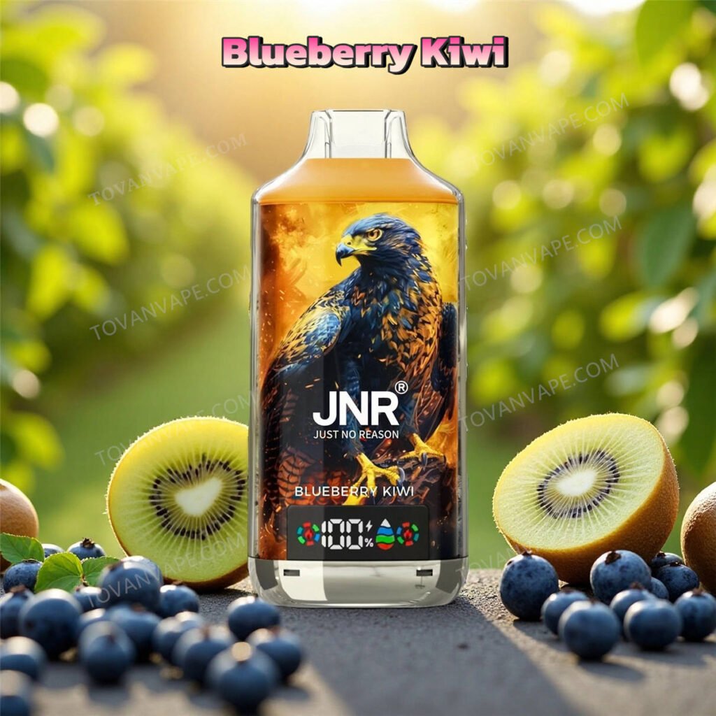 Dispositivo jnr falcon x 18k nella variante blueberry kiwi, circondato da fette di kiwi freschi e succosi mirtilli