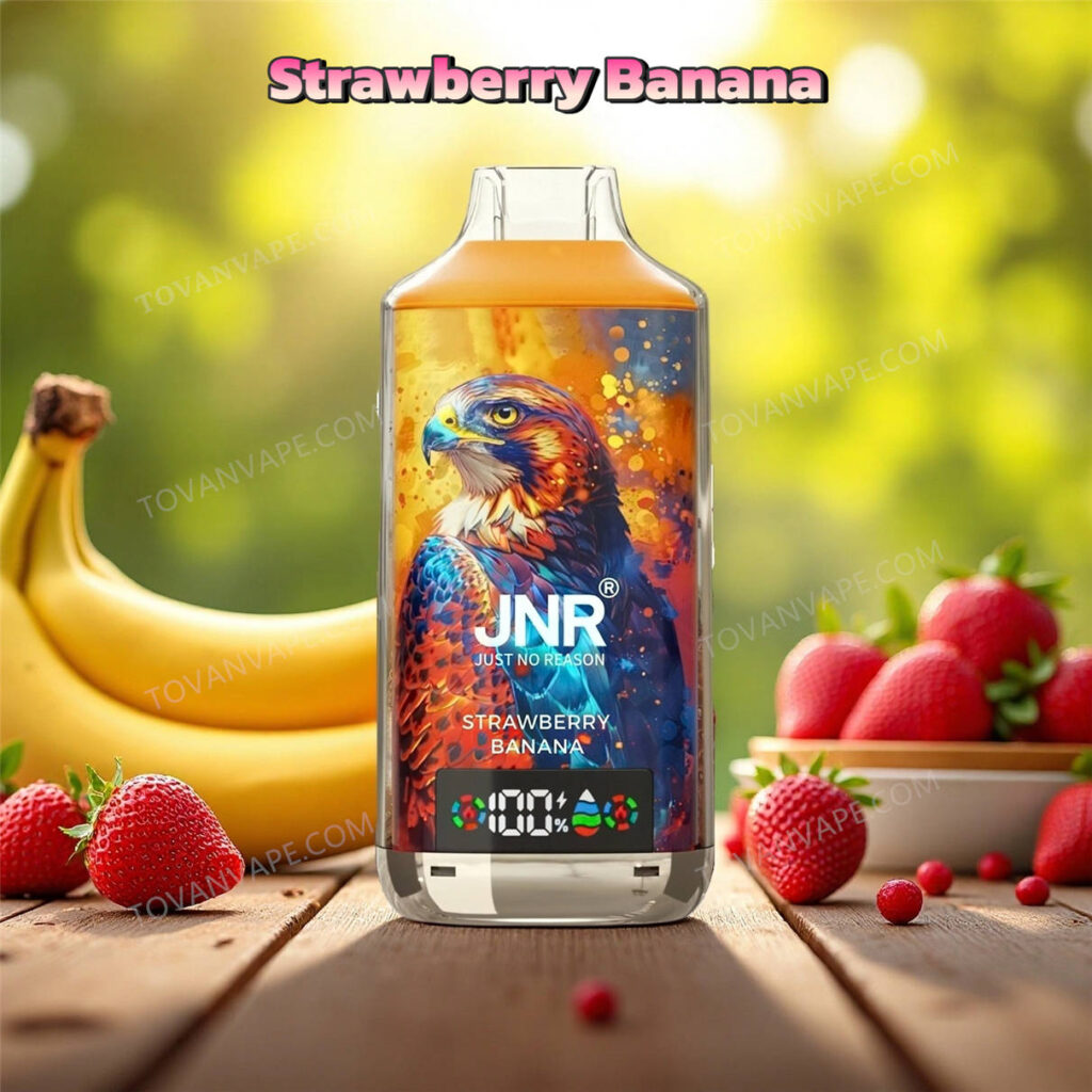 E-cigarette jnr falcon x 18k au goût strawberry banana, agrémentée de fraises rouges fraîches et de bananes jaunes mûres