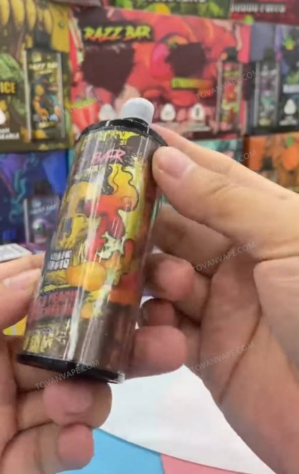 person holding the razz bar 30000, revealing its sleek front design